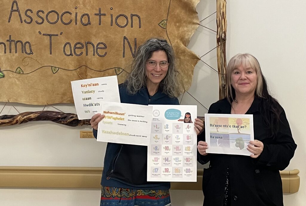 Copper River Native Association Ahtna language teacher Carol Cozzen and Copper River Record editor Allison Sayer with some elementary Ahtna worksheets. With grant funding, Allison and designer Michelle McAfee are collaborating with Carol to increase the amount of Ahtna language in the paper.