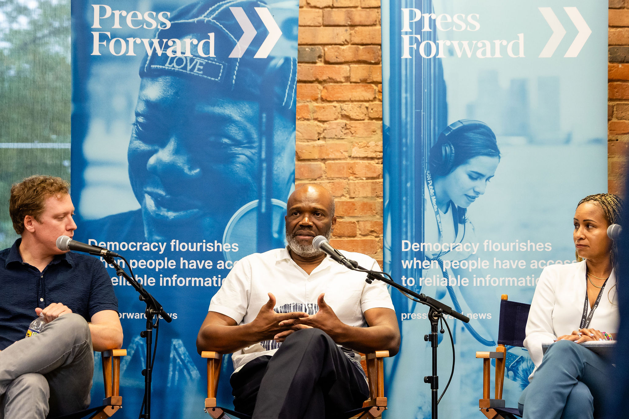 Glenn Burkins, founder of Charlotte's QCity Metro, speaks at a Press Forward event.