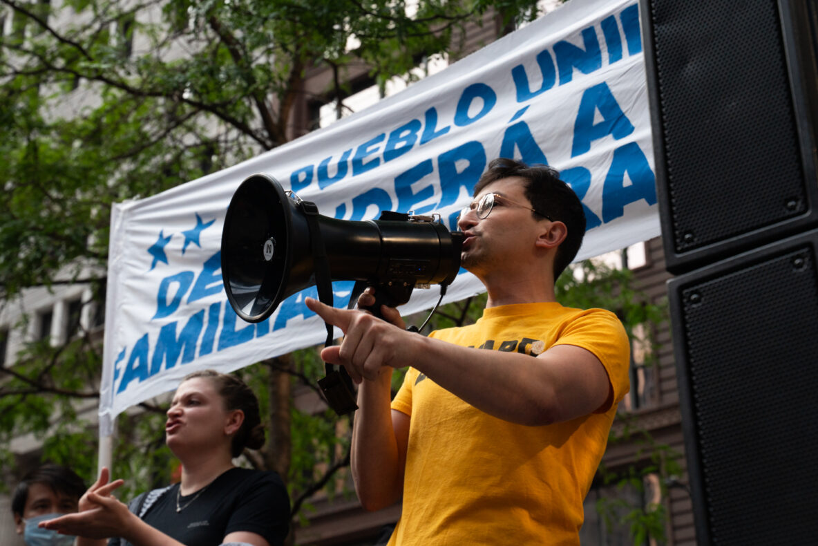 Organizer Diego Morales speaks at a rally before taking to the streets to protest ICE. Image by Camilla Forte for Borderless Magazine