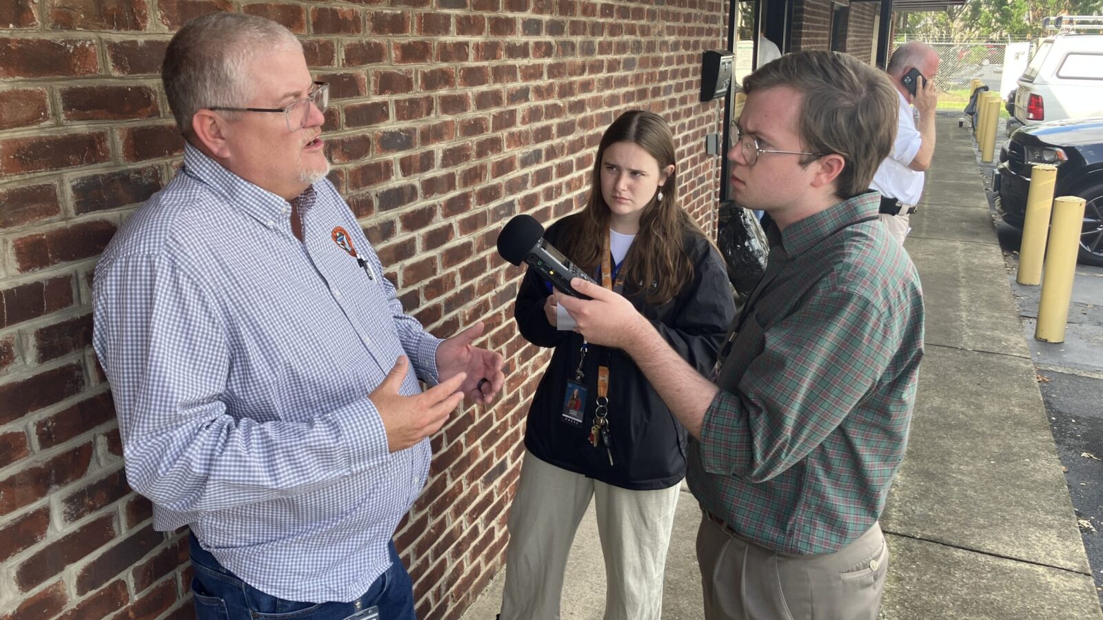 Pierce Gentry (right) of WUOT in Knoxville, Tenn., doing an interview out in the field. WUOT public radio is part of the Appalachia + Mid-South Newsroom collaboration
