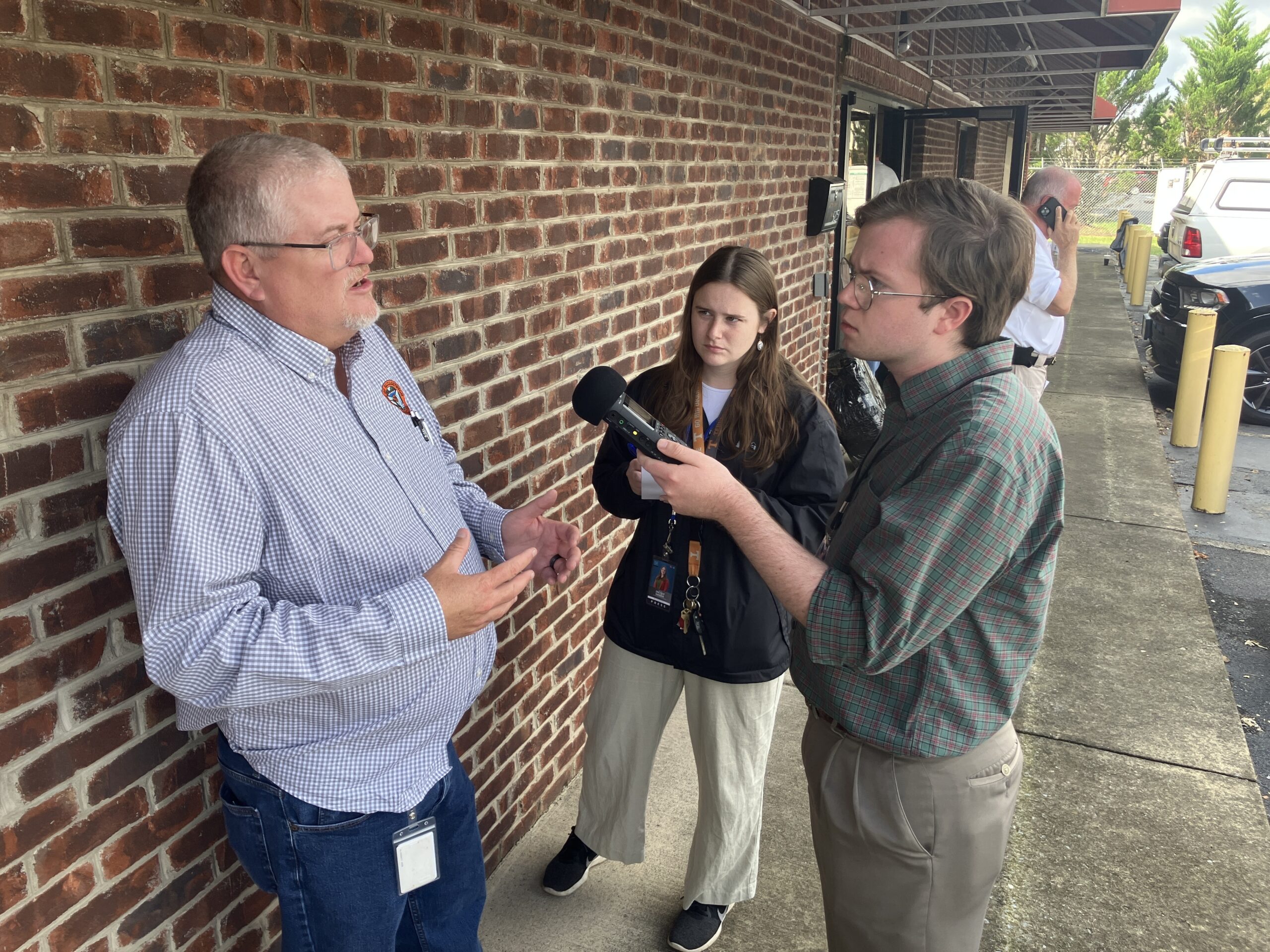 Pierce Gentry (right) of WUOT in Knoxville, Tenn., doing an interview out in the field. WUOT public radio is part of the Appalachia + Mid-South Newsroom collaboration