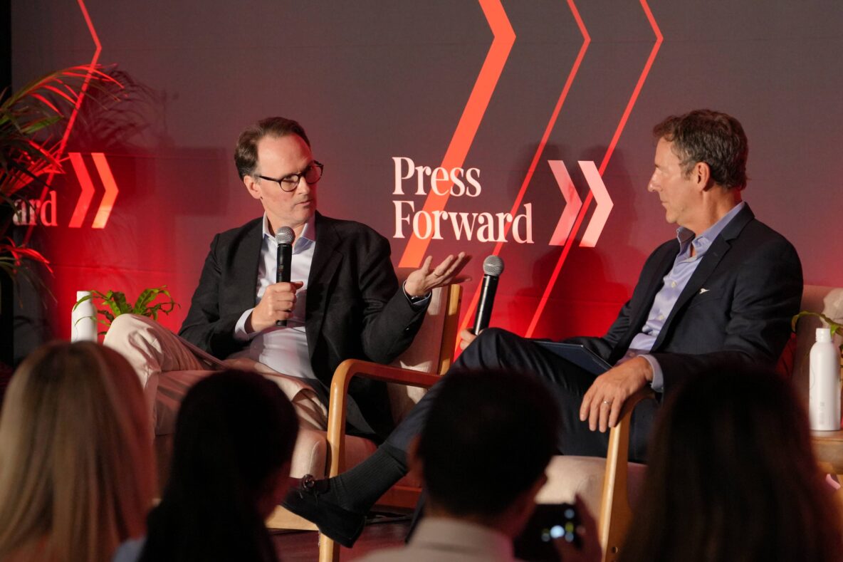 John Palfrey of MacArthur Foundation and Mark Updegrove of the LBJ Foundation on stage at the Press Forward Summit.